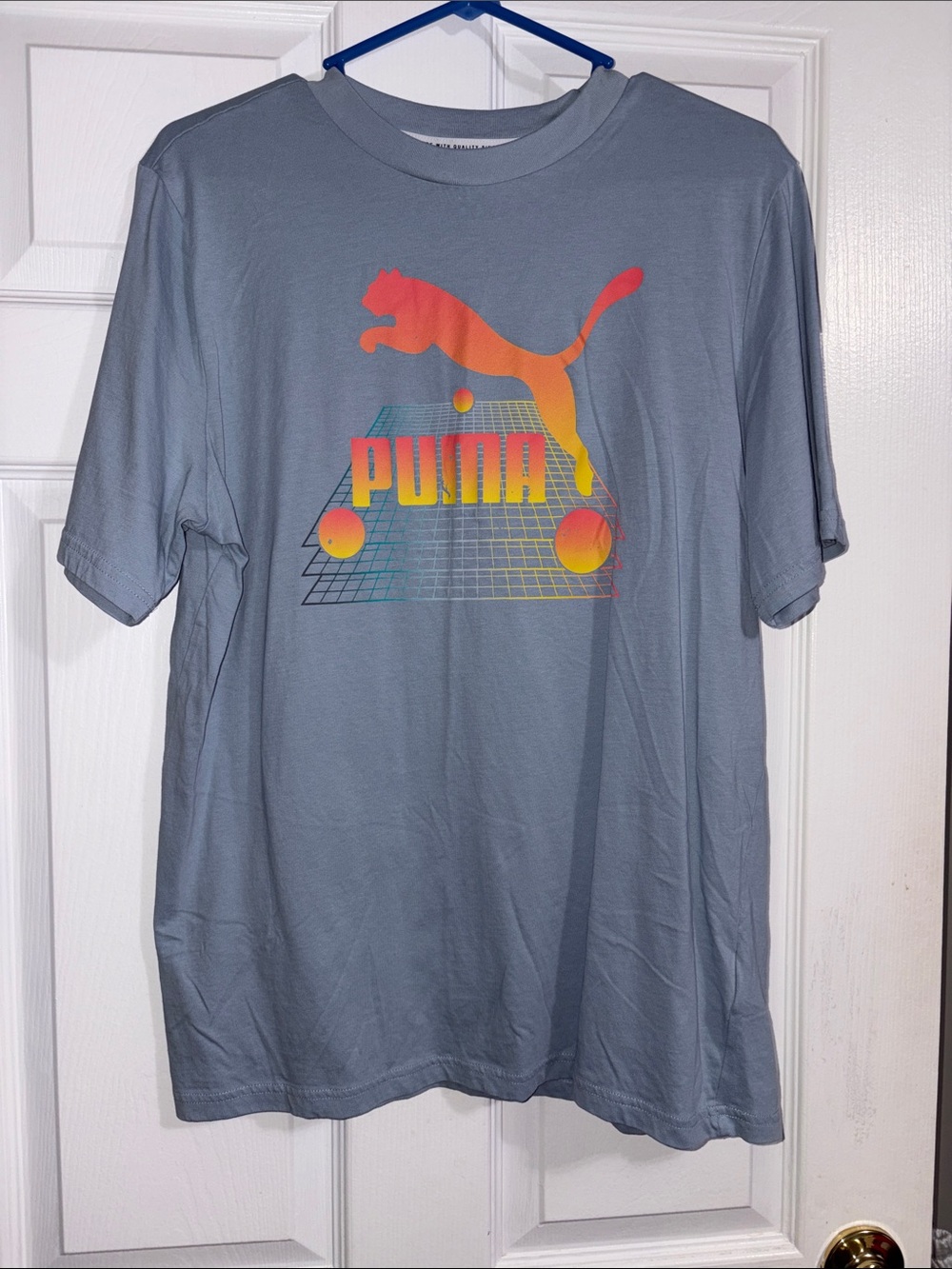 Puma Light Blue Tee with Neon Gradient Puma Logo size large women